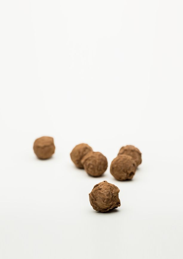 Handmade chocolate treats filled with licorice caramel and rolled in licorice powder from BECH Chocolate on Bornholm