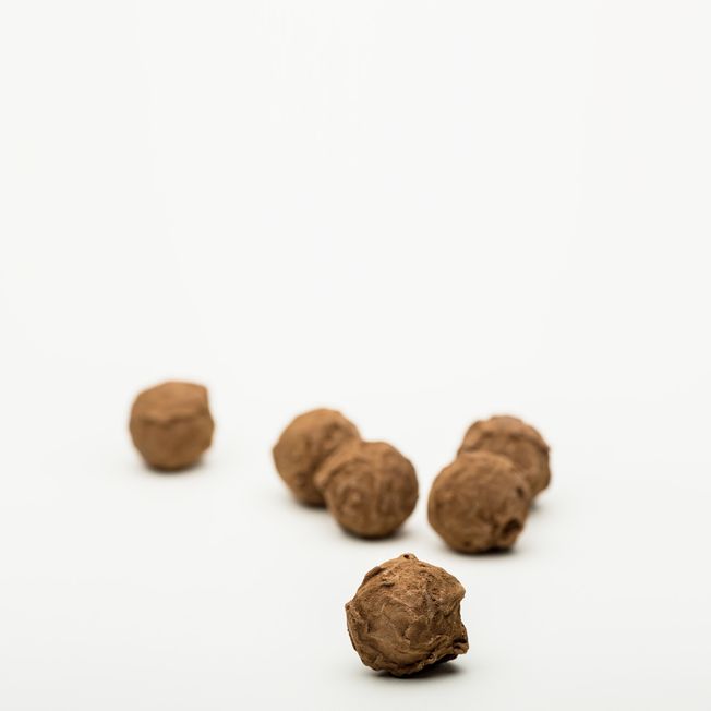 Handmade chocolate treats filled with licorice caramel and rolled in licorice powder from BECH Chocolate on Bornholm